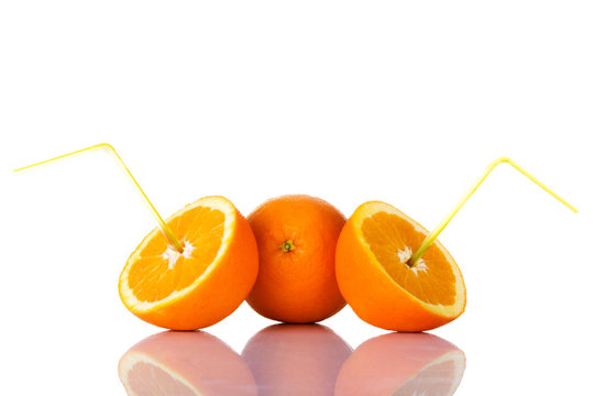 Fresh oragnes with straws.