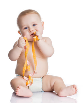 Adorable Baby Boy with a measuring tape on white background