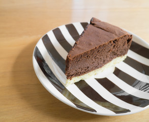 Chocolate cheesecake on a strip plate.