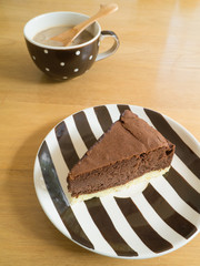 Chocolate cheesecake on a strip plate.