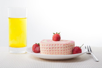 Strawberry Roll Cake with drink and fork