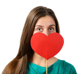 portrait of attractive happy smiling teen girl with red heart, l