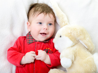 Fototapeta premium cute funny infant baby boy with big toy hare, beautiful kid's po