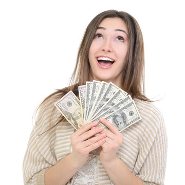 Cheerful attractive young lady holding cash, looking up and happ