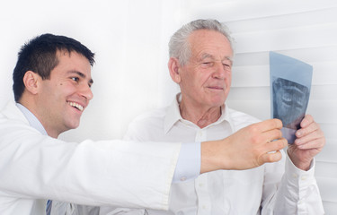 Smiling doctor and senior patient