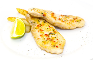 sturgeon steak cooking on the grill