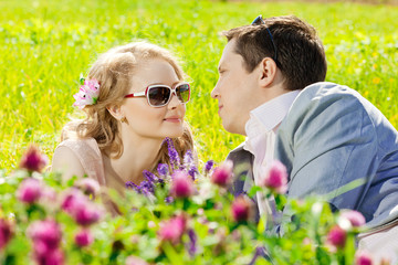 Naklejka premium Happy young adult couple in love on the field. Two, man and wom
