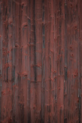 Weathered red painted wooden panel