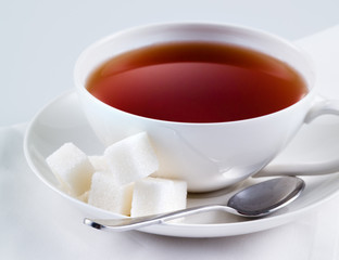 Black tea with sugar cubes