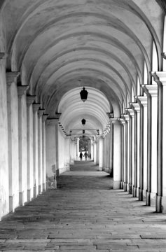 street with the old arcades and the play of light between column