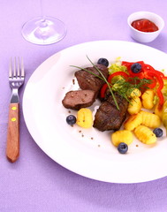 Lamb steak with gnocchi, vegetable and sauce