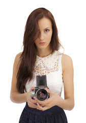 Girl with an old camera on a white background