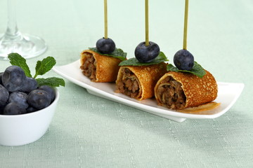 Pancake roll stuffed with minced meat as snack