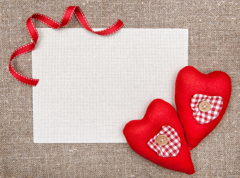 Valentine card with red textile hearts