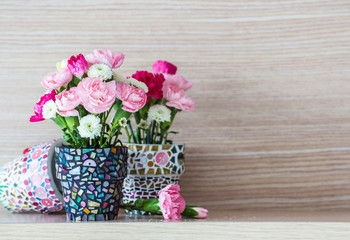 Carnation in mosaic flower pot 