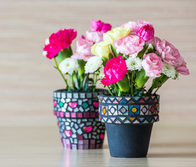 Carnation in mosaic flower pot 