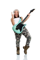 Fototapeta premium Beautiful young woman playing a guitar