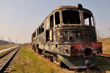 locomotive burnt and abandoned on rails