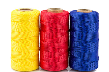three spools of thread isolated
