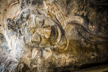 Buddha molding art on stone wall in Thai style