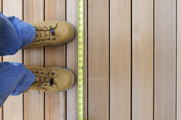 Looking Down at Worker and Tape Measure