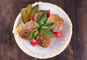 lula lamb and tomatoes on a plate