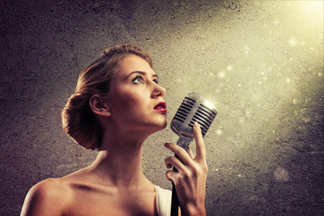 attractive female singer with microphone