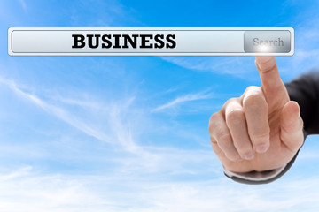 Touching with the finger the button for business