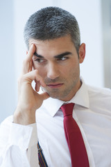 Close-up of pensive Businessman looking off camera