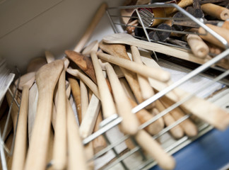 Wooden spatulas on shelf in utensil store