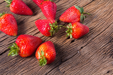 Fresh strawberries on old wooden background