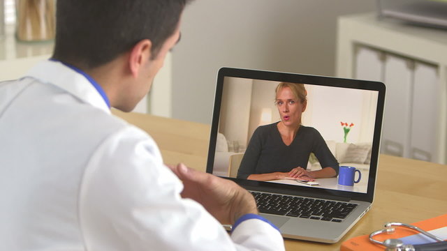 Doctor talking to patient through the internet