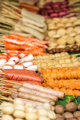 Street food in Thailand - fried sausages and meatballs
