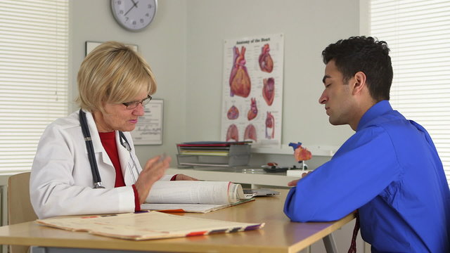 Side view of doctor and patient talking