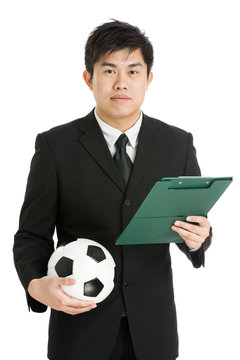 Football manager with soccer ball and tactcial board