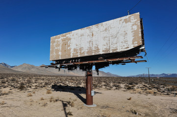 Old rusted blank billboard by road - obrazy, fototapety, plakaty