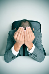 businessman with his hands in his head