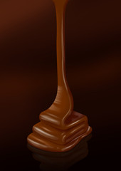 Chocolate flow isolated on dark background -Clipping path