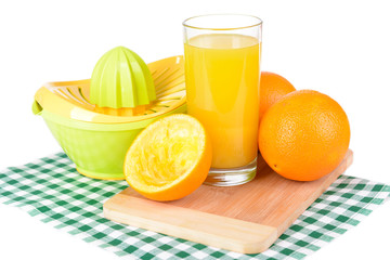 Citrus press and oranges isolated on white