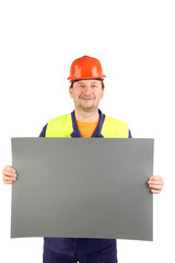 Worker in hard hat with paper.