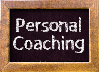 Personal coaching message written on a blackboard