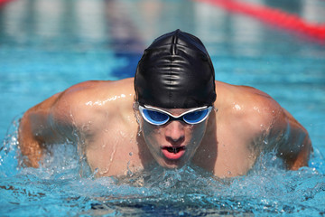 Close up of swimmer  Man swimming butterfly strokes