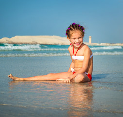 Fototapeta premium little girl on the beach