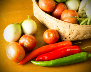 fresh vegetable with basket on wooden table still life