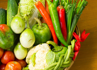 fresh vegetable with basket on wooden table still life