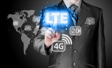 businessman is pushing his finger on lte button