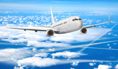 Fototapeta na wymiar Passagierflugzeug über den Wolken