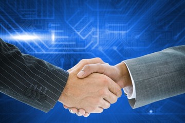 Composite image of business handshake