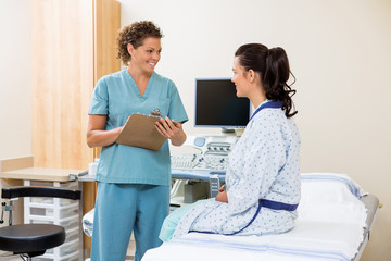 Nurse Looking At Patient Before Ultrasound Test