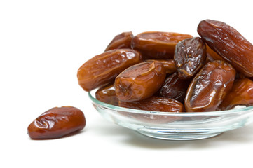 juicy figs in a glass bowl on white background